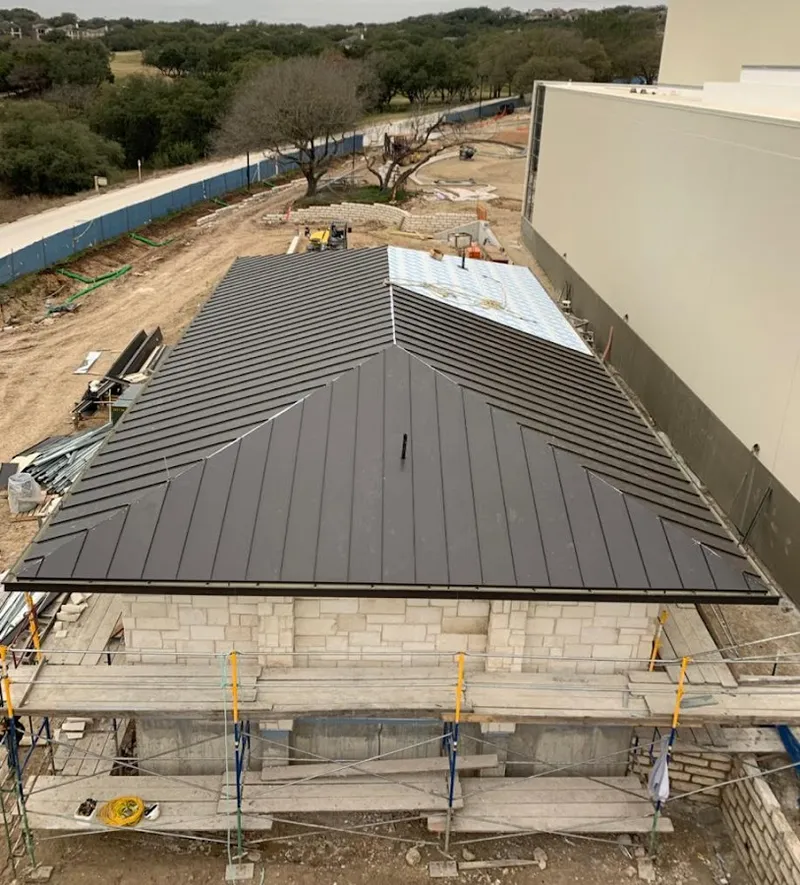 Metal roof new construction with scaffolding in Sansom Park