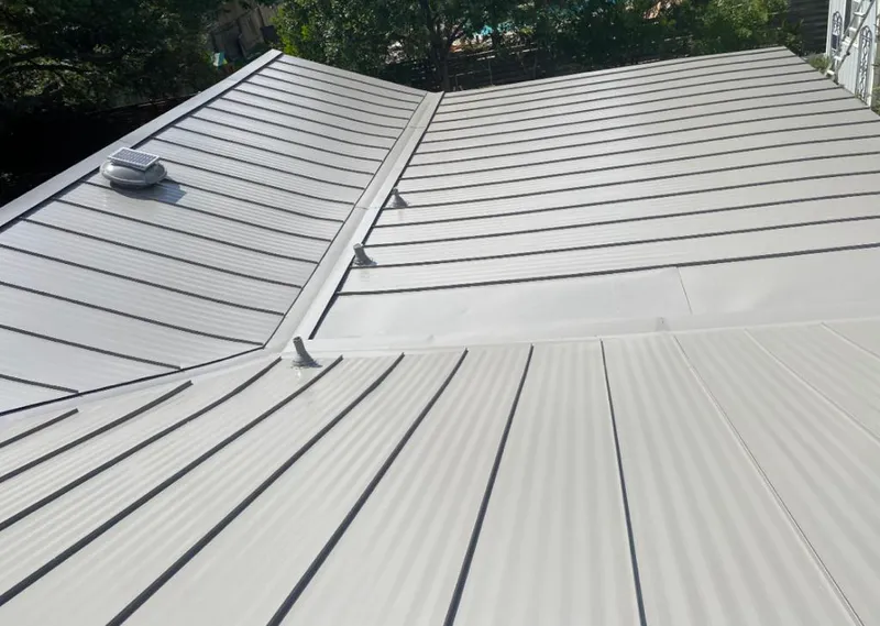 Solar attic fan installed on a metal roof for Roof Ventilation in Sansom Park